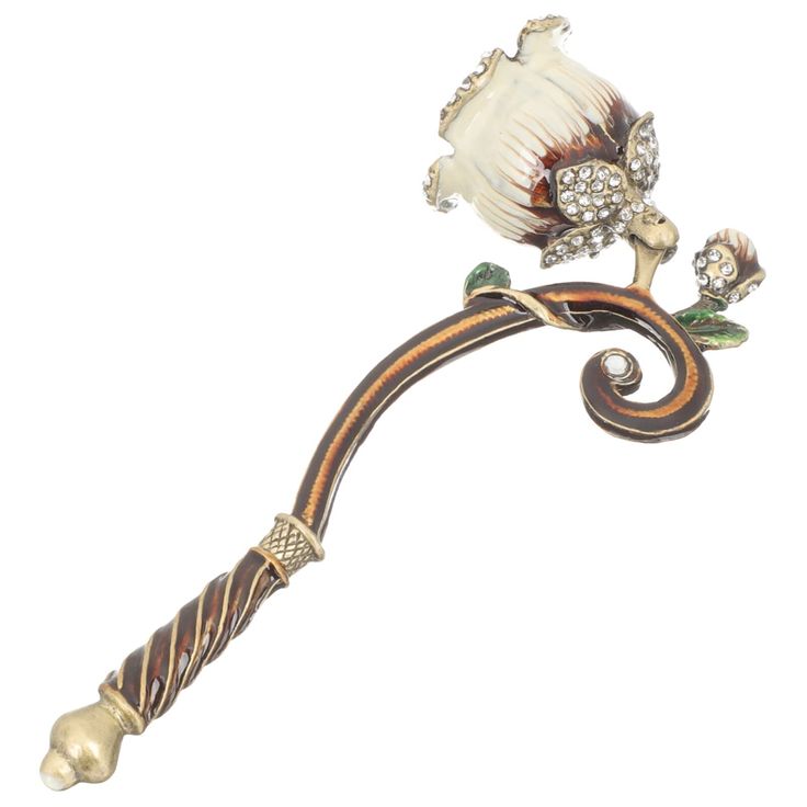 an ornate metal handle with flowers on it