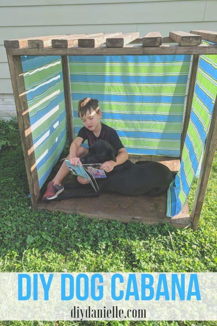 a young boy sitting in a diy dog cabana