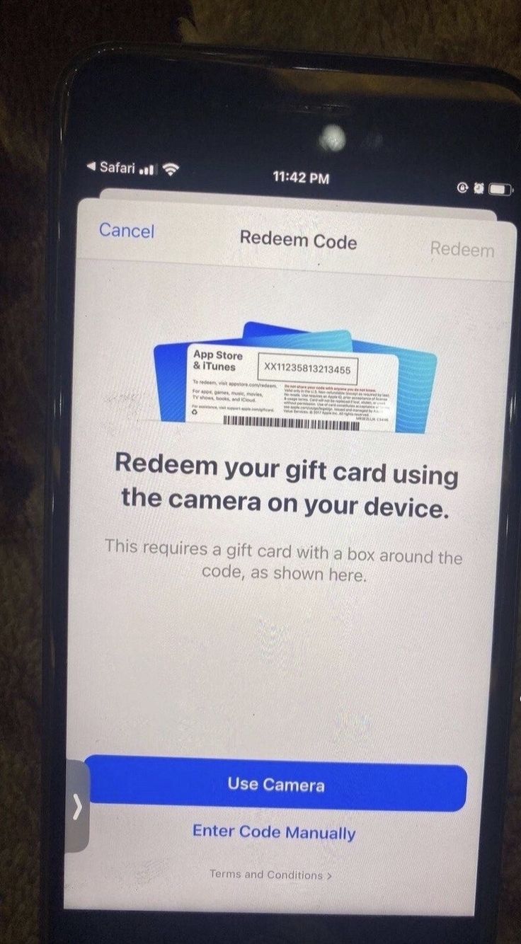 a cell phone with the redeem code on it