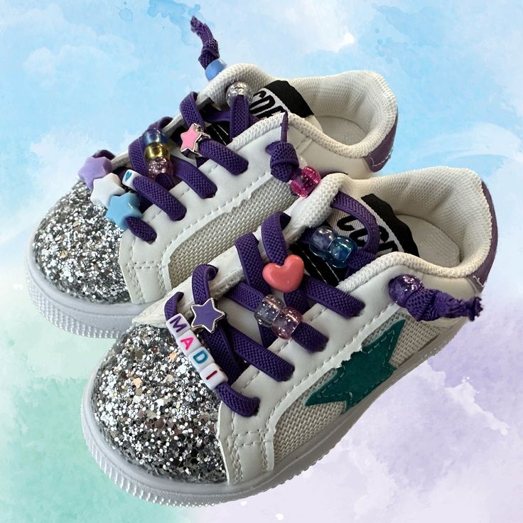 The cutest customized sneakers! ⭐️ WHAT'S INCLUDED IN THIS LISTING ⭐️ *Name/nickname/title using  BLACK  or WHITE block bead letters (no additional cost for lengthy names!) *Matching assorted beads, including charms seen in listing photos.   *I will curate the beads to best match the sneaker you pick.  If you have any specific color theme or bead preference, just let me know. ⭐️ SIZING ⭐️ EU    US 21     5.5 22     6-6.5 23     7 24     7.5-8 25     8.5-9 26     9.5 27     10-10.5 28     11 29 Customizable Lace-up Sneakers For Gift, Sporty Low-top Sneakers Gift, Adjustable Sneakers With Elastic Laces And Round Toe, Customizable Lace-up Sneakers For Gifts, Adjustable Low-top Non-slip Sneakers, Playful White Customizable Sneakers, Pink Adjustable Lace-up Sneakers, Casual High-top Sneakers For Birthday, Casual Lace-up Sneakers For Birthday