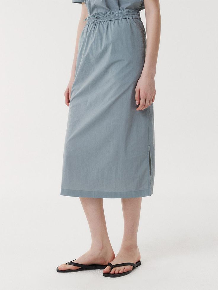 This is a clean and casual skirt by EAAH that is made out of high quality and sturdy fabric. With unique design detail and trendy mood, you can style it for your refined and casual daily outfit.- Side seam pocket- Set up with matching blouse- Elastic banding and string and stopper detail- Semi A line silhouette Everyday Summer Skirt With Pockets, Cotton Relaxed Skirt For Everyday, Gray Cotton Skirt For Spring, Everyday Relaxed Cotton Skirt, Everyday Relaxed Fit Cotton Skirt, Spring Gray Cotton Skirt, Flowy Everyday Midi Skirt, Everyday Flowy Midi Skirt, Cotton Skirt With Relaxed Fit For Work