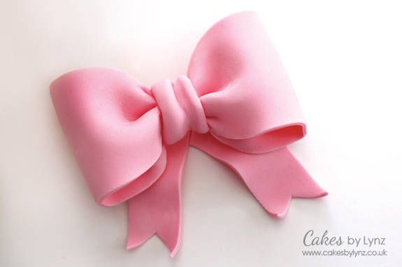 a pink bow on a white background