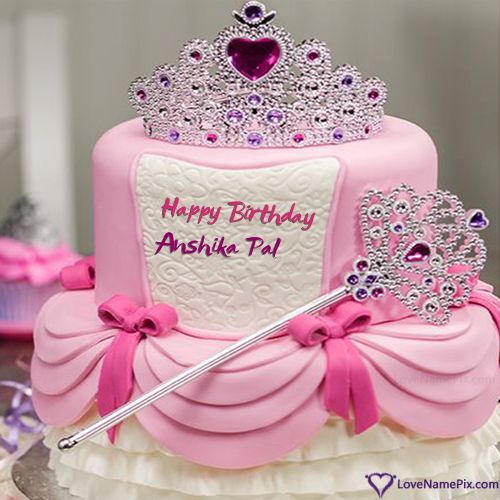 a pink birthday cake with a tiara on top