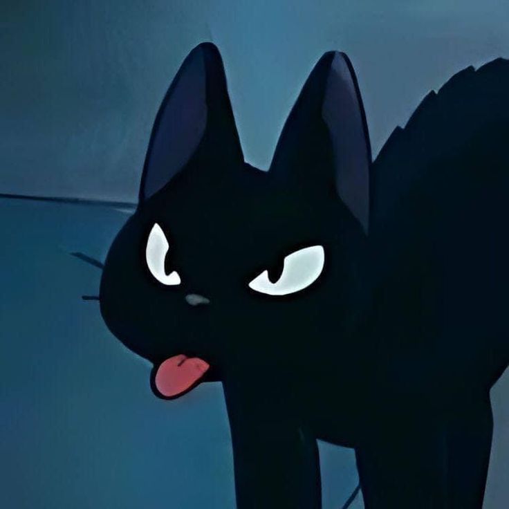 black cat with glowing eyes and tongue sticking out