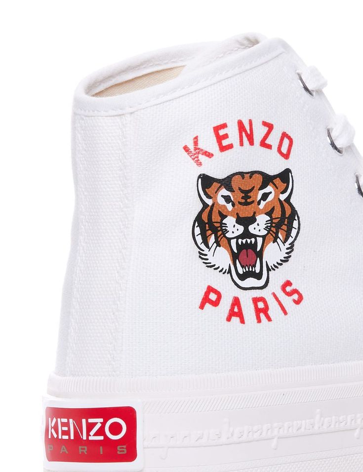 Kenzo high-top sneakers made of cotton canvas and decorated with Kenzo Lucky Tiger logo print on the outer side. Rubber toe, silver-tone metal eyelets. cotton interior with lightly padded insole and rubber sole featuring embossed signature along the sides and logo patch on back.Heel height: 3,5 cmGender: WOMENMaterial: 100% COTTONColor: WHITEMade in: VNProduct ID: FE52SN025F76 01*Import tax/duty will be calculated at checkout (If applicable) White Lace-up High-top Sneakers With Logo Detail, Streetwear High-top Lace-up Sneakers With Embroidered Logo, Canvas High-top Lace-up Sneakers With Logo Print, White-sole High-top Sneakers With Logo For Streetwear, High-top Sneakers With Logo For Streetwear, Sporty High-top Sneakers With Embroidered Logo, White High-top Sneakers With Embroidered Logo, Lace-up High-top Canvas Sneakers With Logo, Logo Print High-top Sneakers For Streetwear