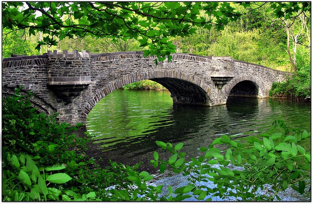 a stone bridge over a body of water