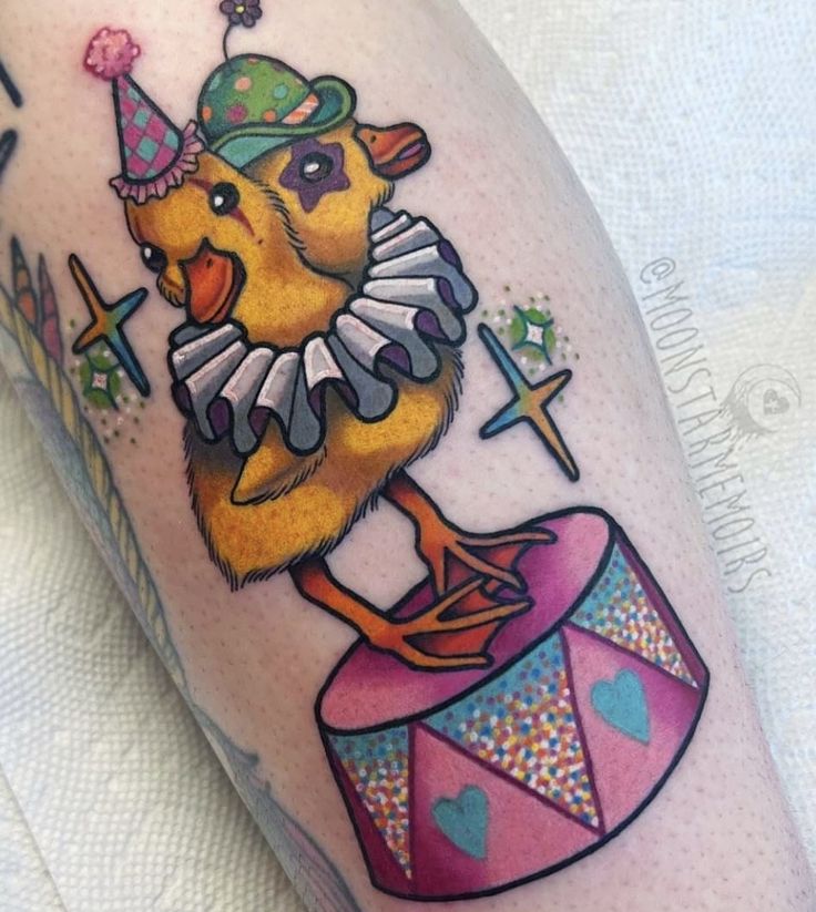 a yellow bird with a party hat on its head