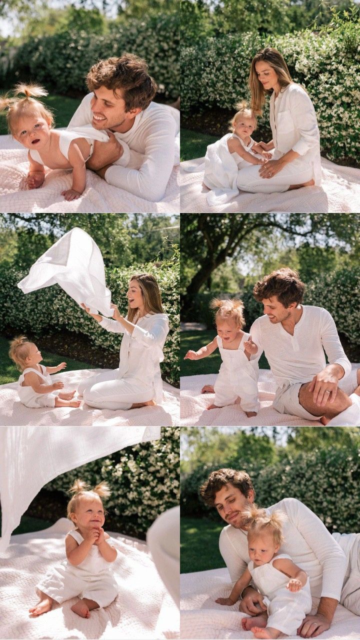 a man and woman sitting on top of a bed next to a baby