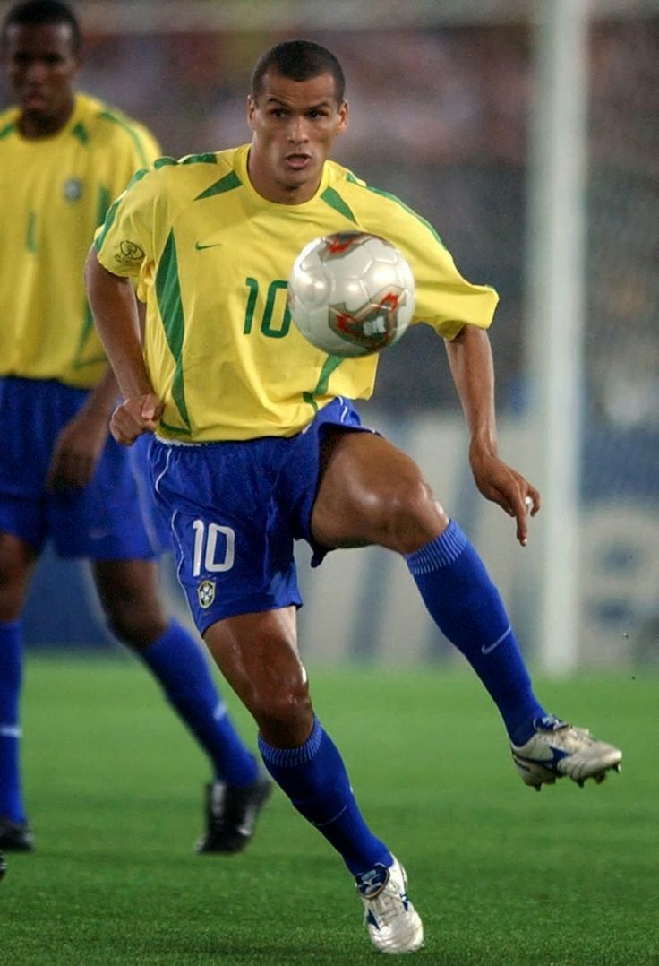 soccer players in action on the field during a game