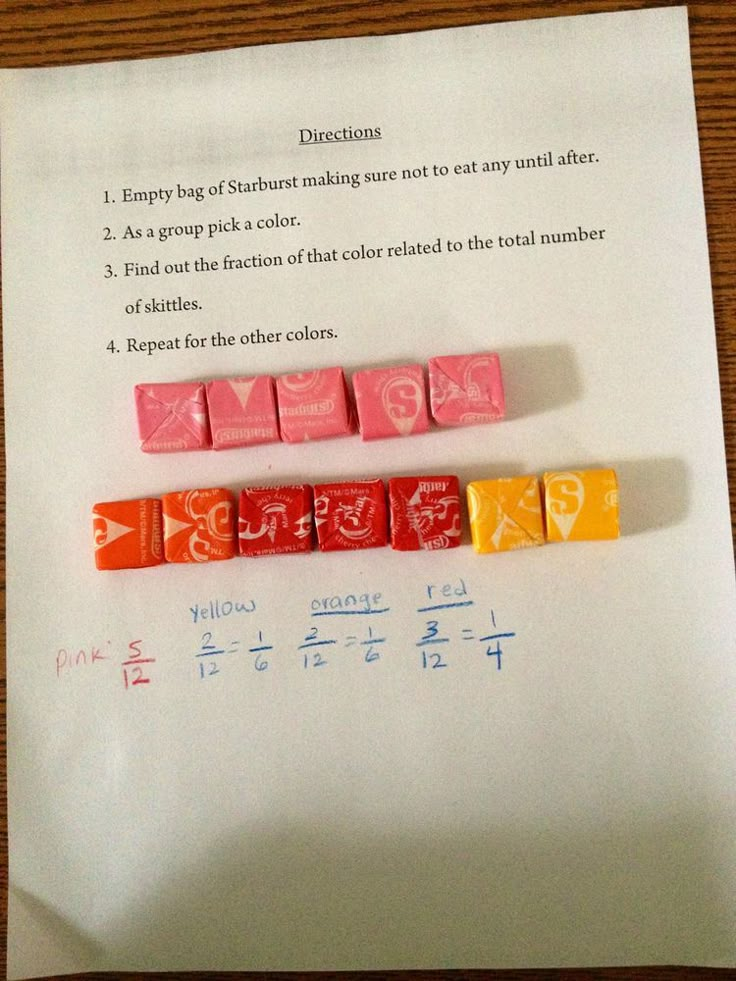 some dices are sitting on top of a piece of paper with numbers and symbols