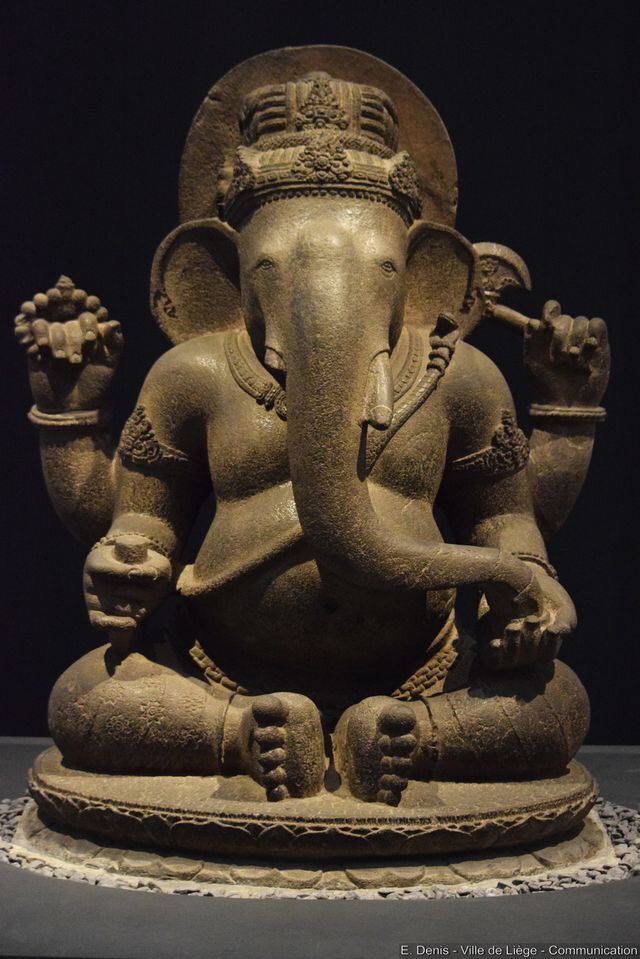 an elephant statue sitting on top of a table