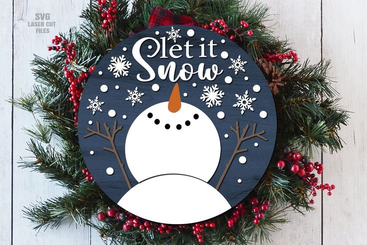 a christmas wreath with a snowman on it