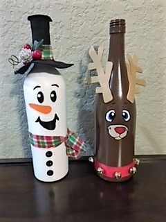 two christmas decorations made to look like snowmen and reindeer bottles sitting on a table