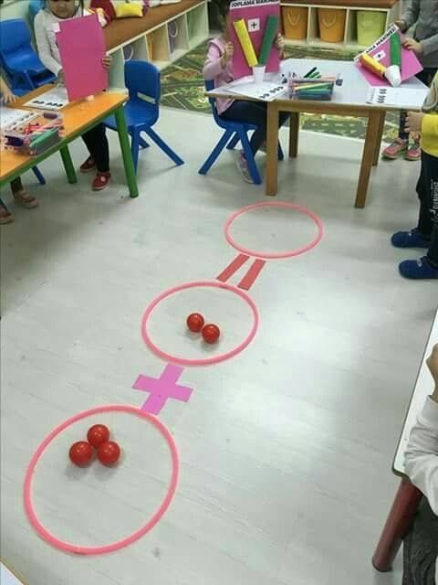 children in a classroom playing with circles and letters that spell out the word'o '