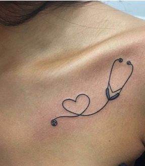 a woman with a stethoscope tattoo on her back and shoulder, showing the heart shaped stethoscope