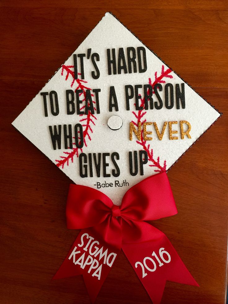 a graduation cap with the words it's hard to beat a person who gives up