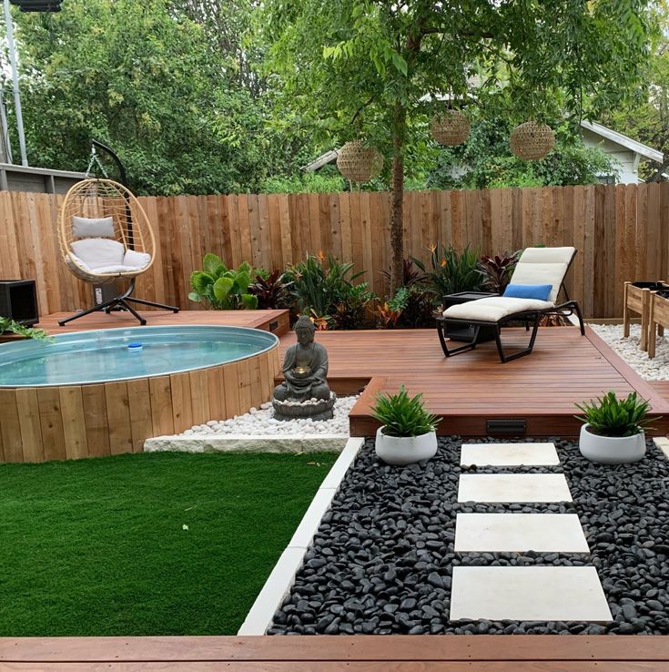 a small backyard with a pool and deck