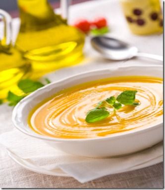 a white bowl filled with soup on top of a table