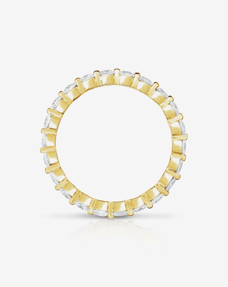 This delicate single-prong setting beautifully displays a circle of round brilliant diamonds. Oval 14k Gold Eternity Band, Diamond White 14k Gold Eternity Band, White Gold Eternity Band With Single Diamond, Timeless 14k Gold Eternity Band With Diamond Cut, 14k Gold Eternity Band With Single Diamond, Minimalist Yellow Gold Eternity Band With Diamond Accents, Gold Jewelry With Vvs Clarity Lab Grown Diamonds, White Gold Eternity Band With Single Diamond For Promise, Classic 14k Gold Eternity Band With Single Diamond