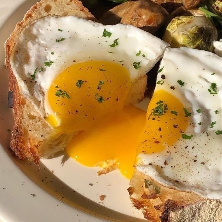 an egg is on top of toast with vegetables