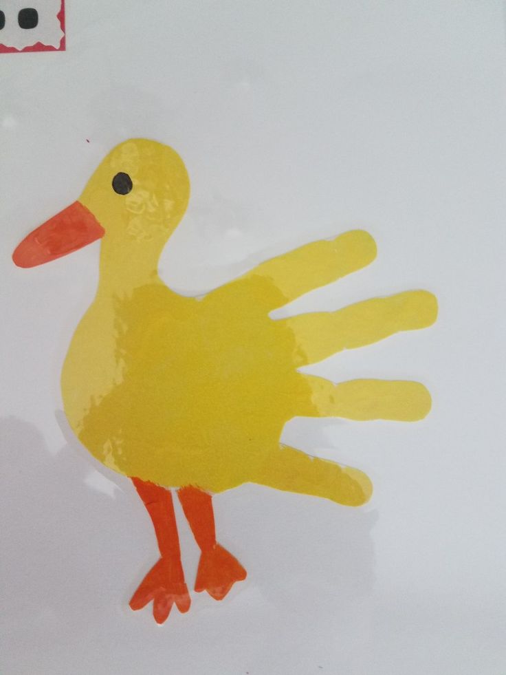 a paper cut out of a yellow duck