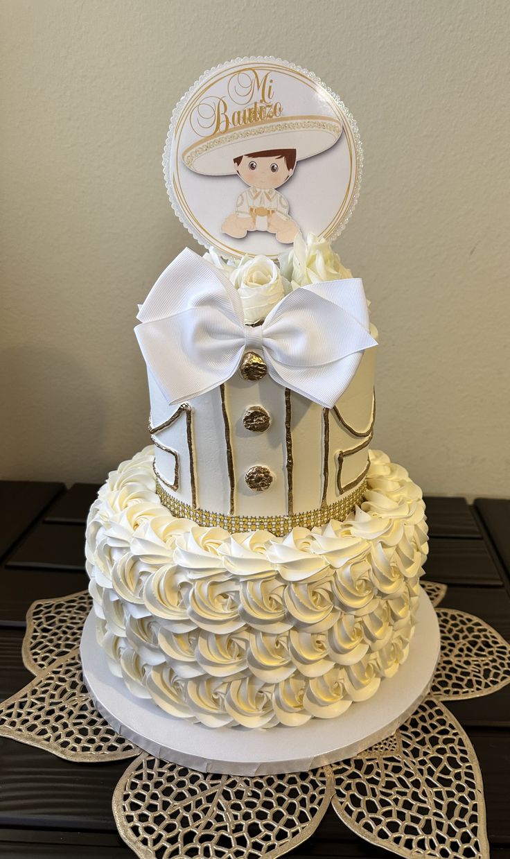 a wedding cake with white and gold decorations