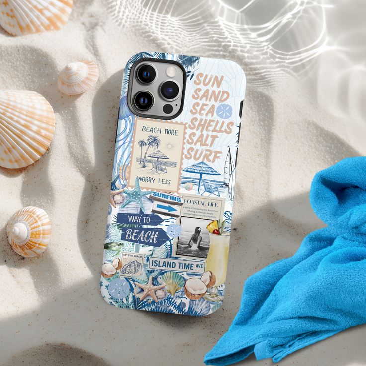 a cell phone case sitting on top of a sandy beach next to blue towels and seashells