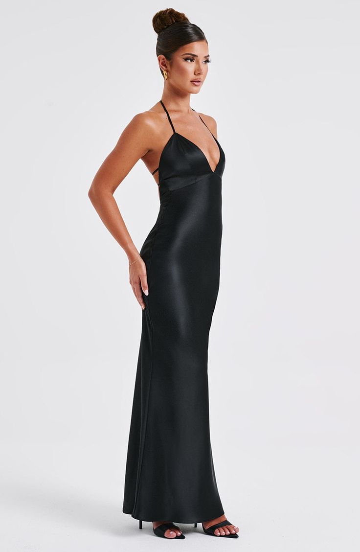 From engagement party to chapel ceremony, whatever the dress code, wear Delphine for every special occasion. Crafted in our premium non-stretch satin with a beautiful sheen, this maxi dress has a plunge halter neckline, super low scoop back with delicate elastic straps. Wear with a chic, undone hair up and metallic accessories. 



Colour: Black.

Premium non-stretch satin.

Plunge halter neckline.

Hook closure on neck.

Elastic straps to back.

Low scoop back.

Invisible zipper to reverse.

Ma V Neck Satin Dress, Homecoming Dresses Corset, Midi Dress Wedding Guest, Backless Maxi Dress, Spaghetti Strap Maxi Dress, Maxi Dress Sale, Bodycon Maxi Dresses, Backless Design, Sparkle Dress