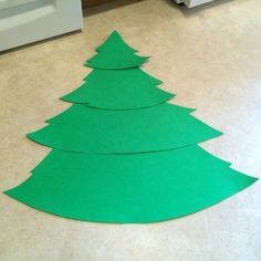 a cut out christmas tree sitting on the floor