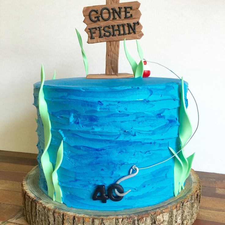 there is a blue cake that has gone fishing on it