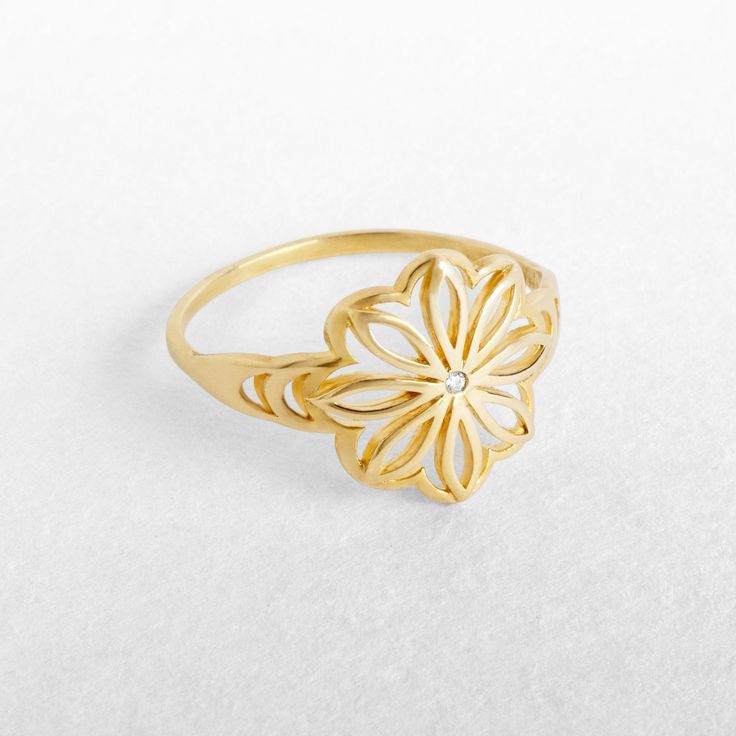 "A unique gold flower statement ring with a delicate clear or black diamond. Handcrafted craftmenship at it's best - 100% Top quality Gold, 100% handcrafted for each and every customer. Maya Mor Jewelry is dedicated to contemporary and avant-garde jewelry and to one-of-a-kind pieces that are personally designed and created by Maya. The jewels are handmade with skillful goldsmithing work and advanced technologies, comfortable to wear due to their ergonomic shapes and carefully finished with the p Ring Gold Engagement, Mandala Ring, Tiny Diamond Ring, Lotus Flower Ring, Delicate Gold Ring, Avant Garde Jewelry, Mandala Jewelry, Lotus Ring, Gold Flower Ring