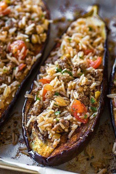 stuffed eggplant with rice and vegetables on a plate