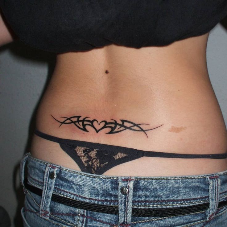 a woman with a tattoo on her stomach