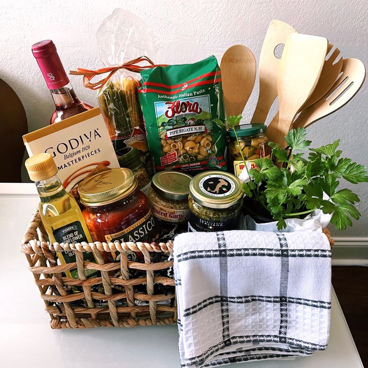 a basket filled with food and condiments sitting on top of a white table