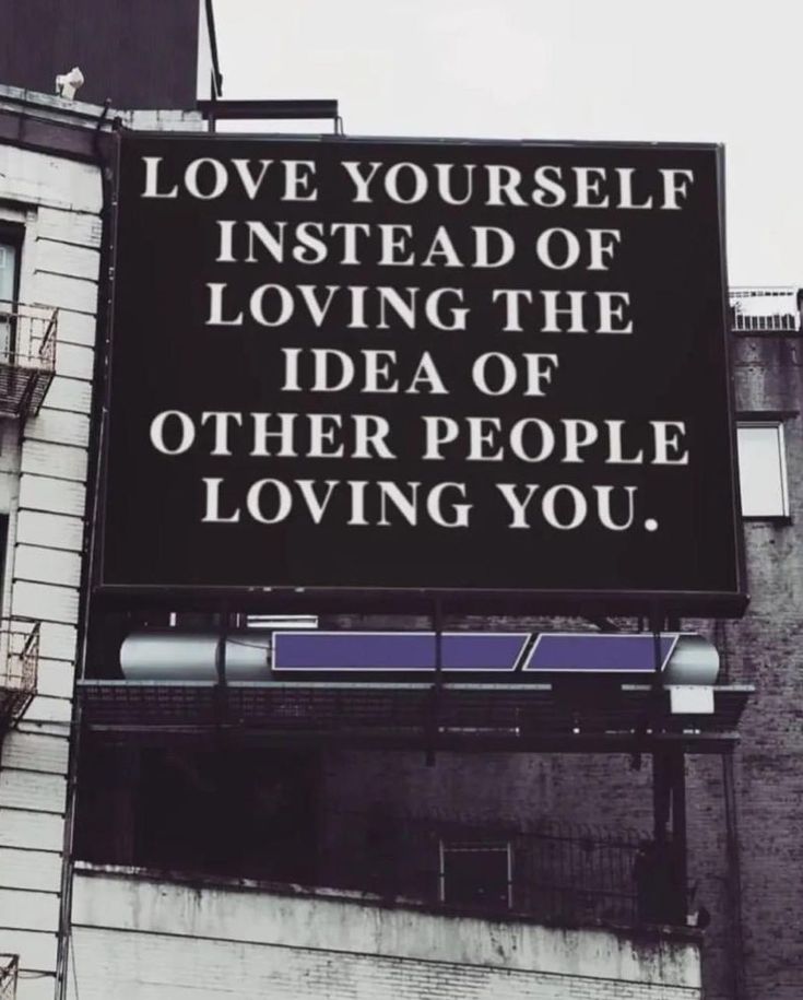 a large sign that says love yourself instead of loving the idea of other people loving you