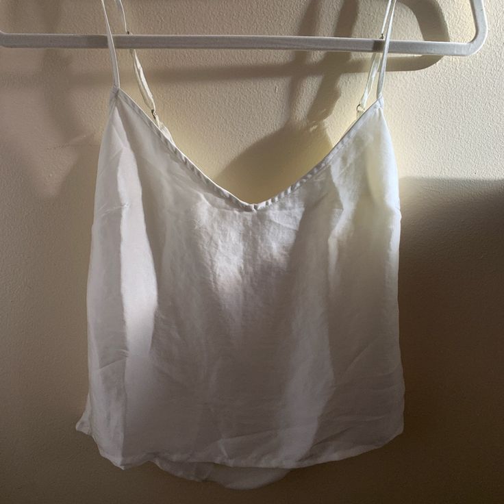 Color: Ivory Original Price: $29 Never Worn Flaw Has A Tiny Spot Inside The Top Near The Tag (May Be Washable) This Top Is Super Classy And Easy To Pair With But Is Too Small For Me Chic White Camisole For Day Out, White V-neck Crop Top For Summer, White Linen Cami Tank Top, White Camisole Crop Top For Day Out, Chic Linen Camisole For Day Out, Casual Spring Camisole For Daytime, Casual Spring Daytime Camisole, White Spaghetti Strap Crop Top For Vacation, White Spaghetti Straps Crop Top For Vacation