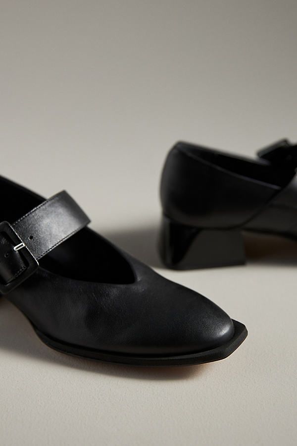 Leather upper, insole Rubber sole Buckle styling Imported | Muluya Mary Jane Heels by Paloma Barcelo in Black, Women's, Size: 39, Leather/Rubber at Anthropologie Mary Jane Leather Court Shoes With Buckle Closure, Chic Leather Mary Janes With Low Heel, Leather Court Shoes With Heel Strap And Square Toe, Mary Jane Heels With Leather Sole For Work, Chic Mary Janes With Ankle Strap And Leather Sole, Chic Mary Janes With Leather Sole And Ankle Strap, Leather Evening Court Shoes With Buckle Closure, Leather Court Shoes With Buckle Closure For Evening, Leather Mary Janes With Sculpted Heel For Evening