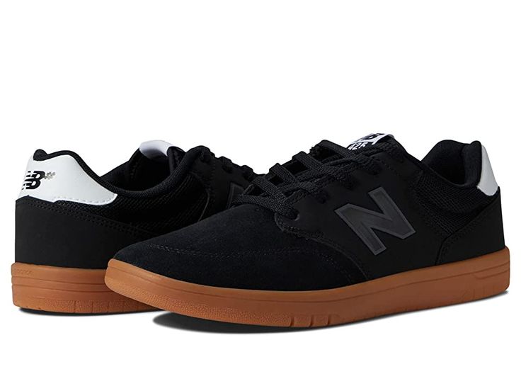 New Balance Numeric 425 - Skate Shoes : Black/Gum 2 : Move with ease from the boardwalk to the bar in the New Balance Numeri 425 sneakers! Coastal-inspired court shoes taking cues from the 520 and 620 styles. Uppers of durable faux-suede and breathable mesh. Lace-up closure. Padded insole for all-day comfort. Non-marking rubber outsole offers long-lasting wear. Imported. Measurements: Weight: 13 oz Product measurements were taken using size US Men's 12, Women's 13.5, width Medium. Please note th Sports Skate Shoes With Gum Sole And Round Toe, Round Toe Skate Shoes With Gum Sole For Sports, Sporty Slip-resistant Skate Shoes With Round Toe, Slip-resistant Round Toe Skate Shoes For Sports, Casual Slip-resistant Skate Shoes For Streetwear, Casual Slip-resistant Skate Shoes With Round Toe, Casual Low-top Skate Shoes With Rubber Heel Cap, Casual Slip-resistant Skate Shoes For Sports, Casual High-top Skate Shoes Slip-resistant