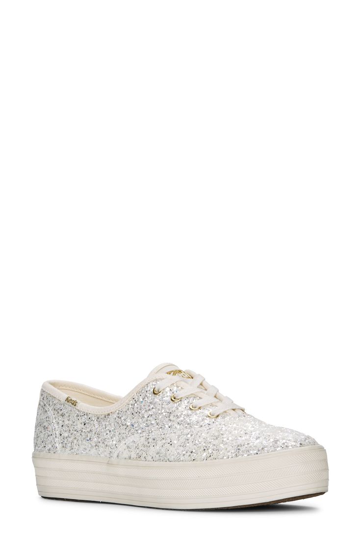 Bring brilliant sparkle to your look in this limited-edition platform sneaker designed as part of the brand's statement-making Celebrations collection. A glitter-dusted leather upper, Softerra-cushioned footbed and flexible sole make it the ideal choice whether you're going to brunch or dancing with family after walking down the aisle. 1" platform   Softerra foam cushioning   Leather and textile upper/textile lining/rubber sole   Imported  Product label may differ from images shown Metallic Glitter Lace-up Sneakers, Low-top Glitter Sneakers In Synthetic Material, Lace-up Synthetic Sneakers With Glitter Print, Synthetic Lace-up Sneakers With Glitter Print, Lace-up Sneakers With Glitter Print, Glitter Print Lace-up Synthetic Sneakers, Casual Metallic Sneakers With Glitter, Casual Metallic Glitter Sneakers, Sparkling Lace-up Synthetic Sneakers