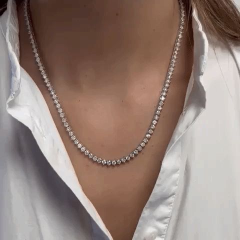 This Diamond Tennis Necklace is a breathtaking piece of jewelry that features a row of dazzling diamonds set in a classic 3-prongs setting. The necklace is crafted from 14K Gold and has a total diamond weight of 10.30 carats. The 3-prongs setting used in this necklace is designed to hold the diamonds securely in place while also allowing maximum light to enter and reflect off the stones. This creates a brilliant and radiant effect that is sure to catch the eye of anyone who sees it. The 14K Gold Tennis Diamond Necklace, Tennis Necklace Diamond, Diamond Tennis Necklace, 14k Yellow Gold Necklace, Accesories Jewelry, White Gold Necklaces, Tennis Necklace, Natural Earth, Jewelry Inspo