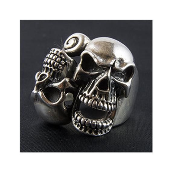 *  Twisted double skulls!      Right pair of freaks!*   Very unusual piece*  Hand made in our workshops in Devon*   Almost 3/4 ounce of  .925 fully hall marked sterling silver ring*  Available in M - Z*  Special Sizes are available on request Gothic Silver Sterling Silver Skull Ring, Silver Stainless Steel Skull Ring In Punk Style, Collectible Silver Skull Jewelry, Nickel-free Silver Gothic Skull Ring, Silver Skull Biker Jewelry, Gothic Silver Skull Ring For Biker Events, Silver Skull Ring Collectible, Silver Symbolic Skull Ring, Biker Silver Skull Jewelry