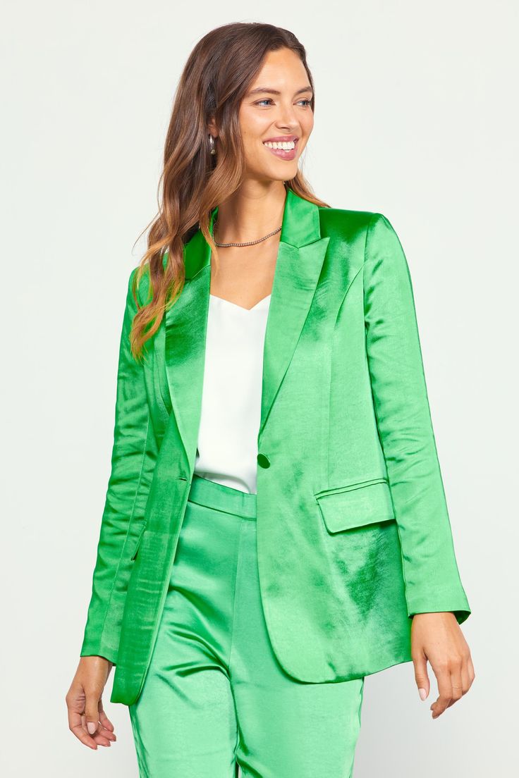 This satin blazer instantly adds a polished finish to any look. Designed with peak lapels, flap pockets, and a single button closure at the front, it can easily do days in the office or make the rounds at your next nighttime occasion. •Peak lapels •Button closure •Flap pockets •Long sleeves with button fastenings •Vented back hem Item number 24826 100% Polyester Classic Satin Outerwear With Suit Collar, Spring Single Button Tuxedo Blazer, Fall Satin Notch Lapel Outerwear, Fall Satin Outerwear With Notch Lapel, Silk Blazer With Lapel Collar For Parties, Notch Lapel Satin Outerwear For Fall, Satin Single Breasted Business Blazer, Single Breasted Satin Outerwear For Business, Business Satin Single Breasted Blazer