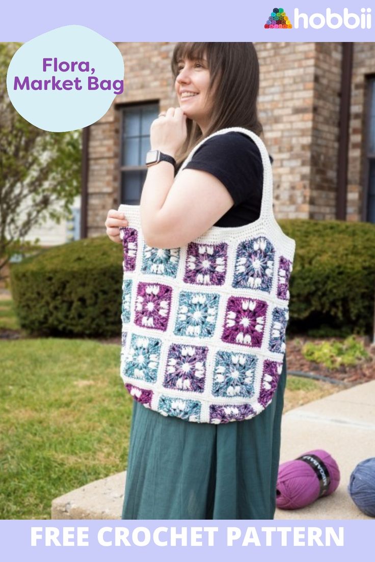 a woman is holding a large bag in front of her face and the text, flora market bag free crochet pattern