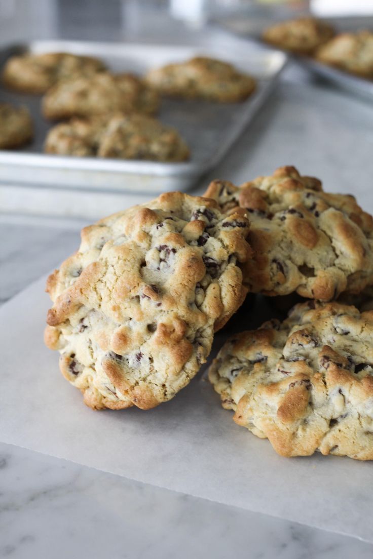 chocolate chip cookies sitting on top of a counter