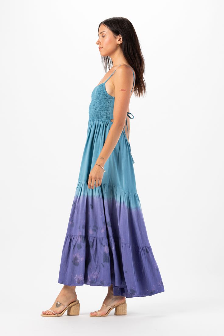 With its floor-grazing length, the Avisa Maxi Dress exudes bohemian elegance, making it perfect for everything from beach weddings to summer soirées. Whether you're dancing under the stars or strolling along the shore, this dress is sure to make you feel like a goddess. Details: 100% Rayon Hand Wash in Cold Water and Lay Flat to Dry Features: Unlined, Smocked Bodice, Self-tie spaghetti strap closure, Tassel tie detail on straps, Open back detail for an adjustable fit, Tiered Maxi Skirt. Measurem Breezy Flowy Maxi Dress For Beach Wedding, Flowy Breezy Maxi Dress For Beach Wedding, Floor-length Smocked Back Dress For Vacation, Floor-length Smocked Back Vacation Dress, Floor-length Vacation Dress With Smocked Back, Floor-length Maxi Dress With Smocked Back For Vacation, Smocked Back Maxi Dress For Beachwear, Summer Floor-length Maxi Dress With Smocked Back, Flowy Breezy Beach Dress For Festival