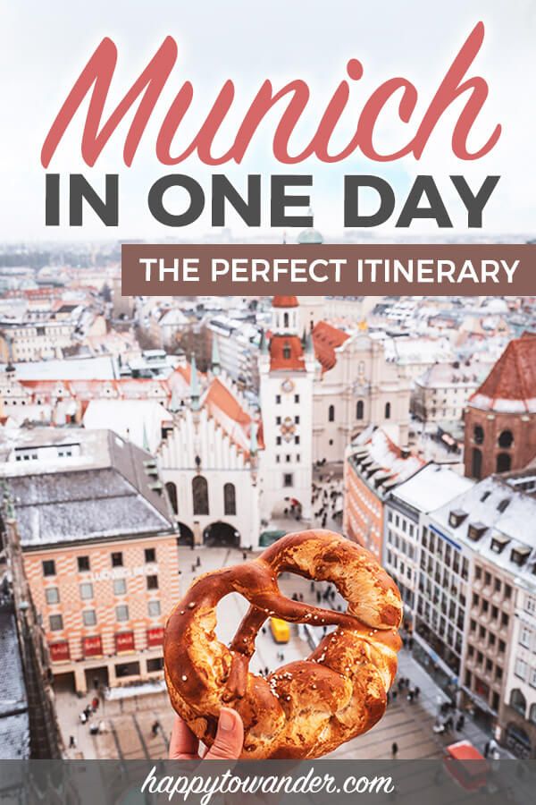 a person holding a pretzel in their hand with the words munch in one day