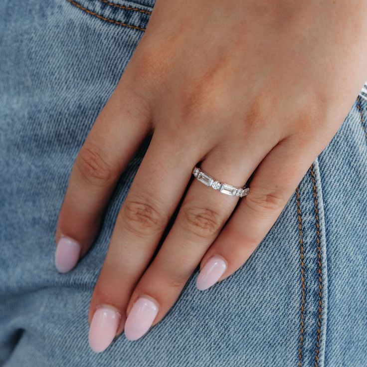 a woman's hand with a ring on her finger