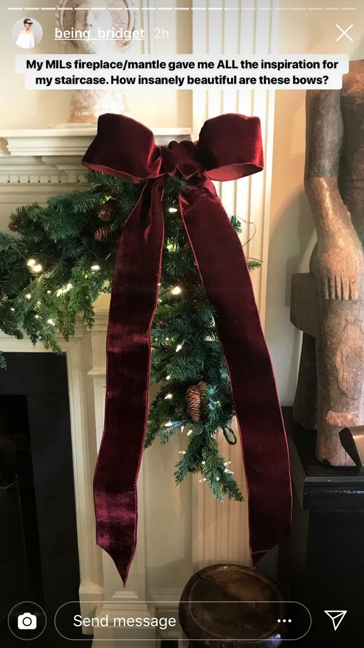 a christmas tree with a red bow hanging from it's side