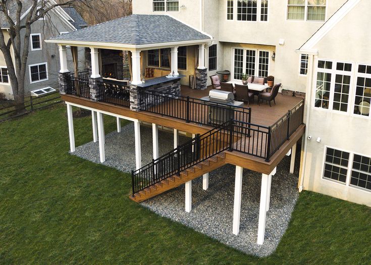 an aerial view of a house with deck and patio