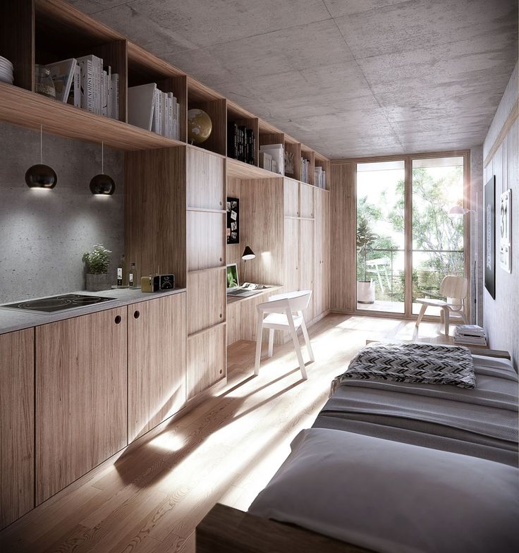 a bed sitting in a bedroom next to a wooden shelf filled with books and other items